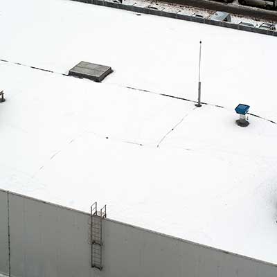 Top view of a typical flat, white commercial roof